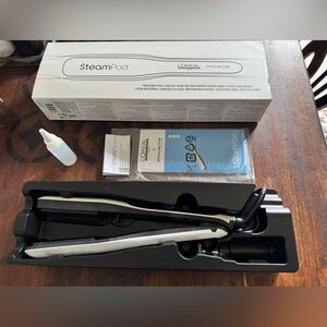 Brand new, never used Loreal Steampod Professional Styler.